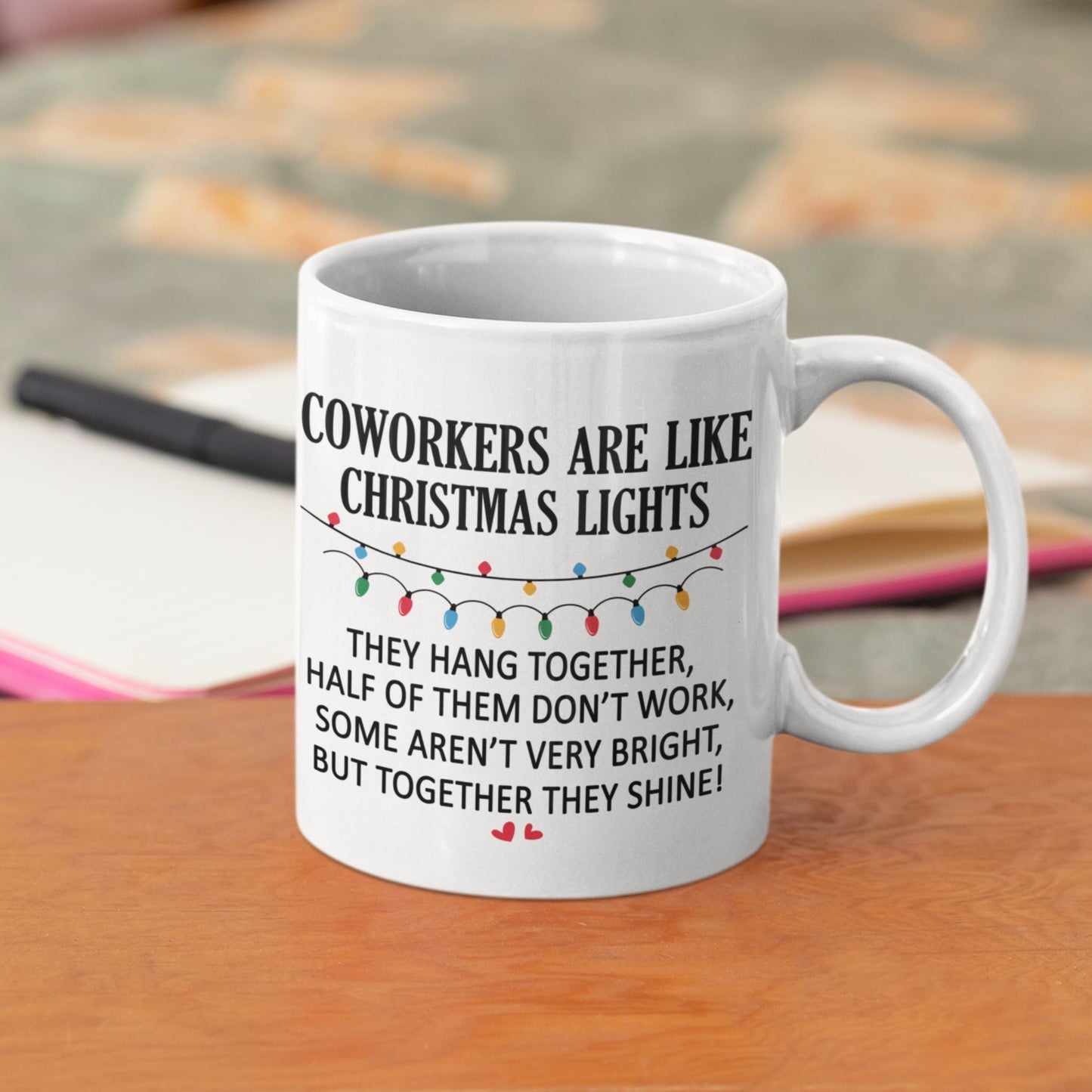 Funny Office Coffee Mug 11oz placed on a casual sofa, highlighting the cheeky message 'Coworkers are like Christmas lights' for a light-hearted touch.