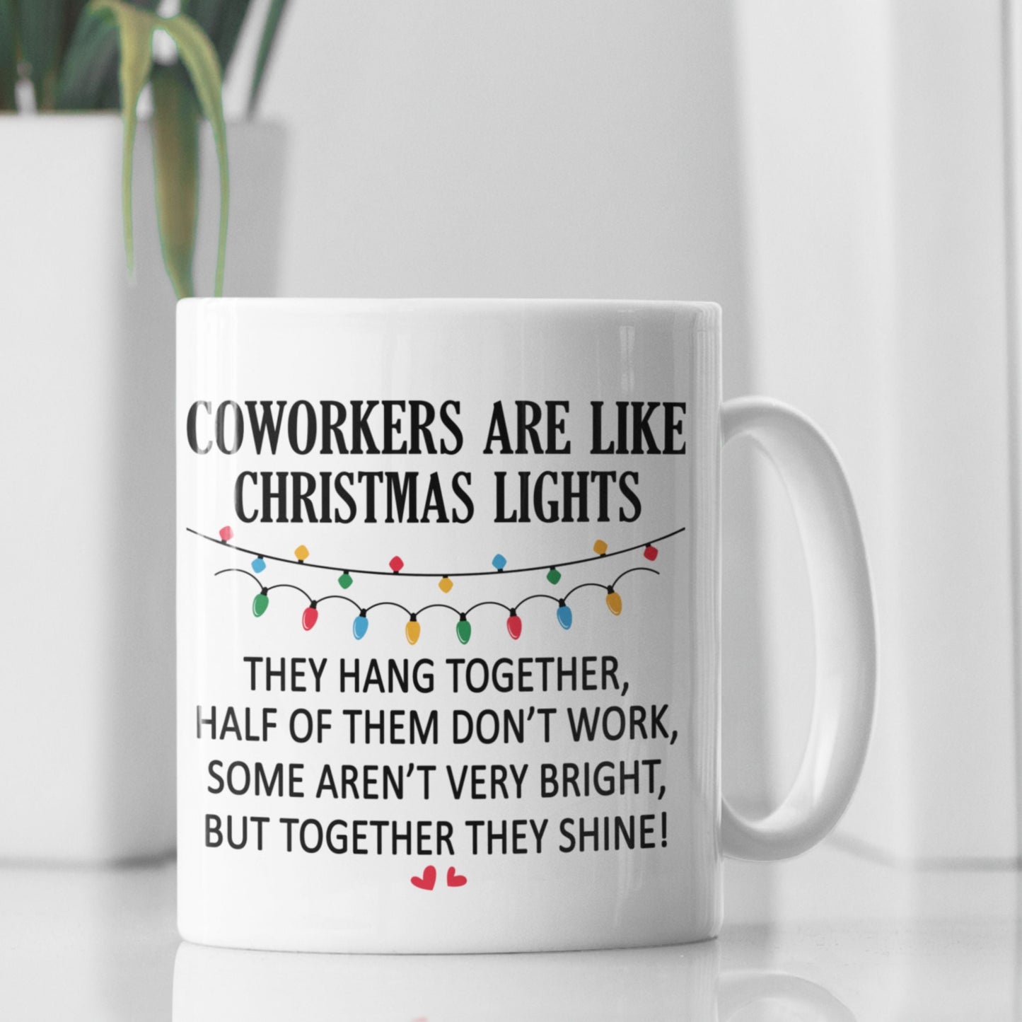 Funny Office Coffee Mug 11oz displayed with a plant in the background, showcasing the playful and humorous design for office use.