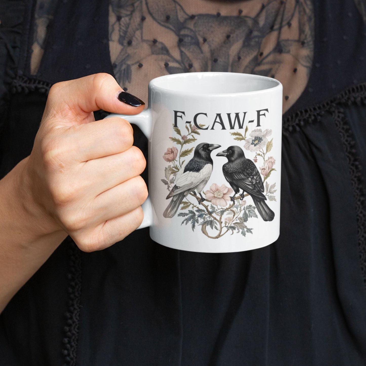Funny Swear Words F Caw Halloween Mug on a kitchen counter with decorative elements around it. This stylish gothic coffee cup adds a touch of fun to your kitchen decor.