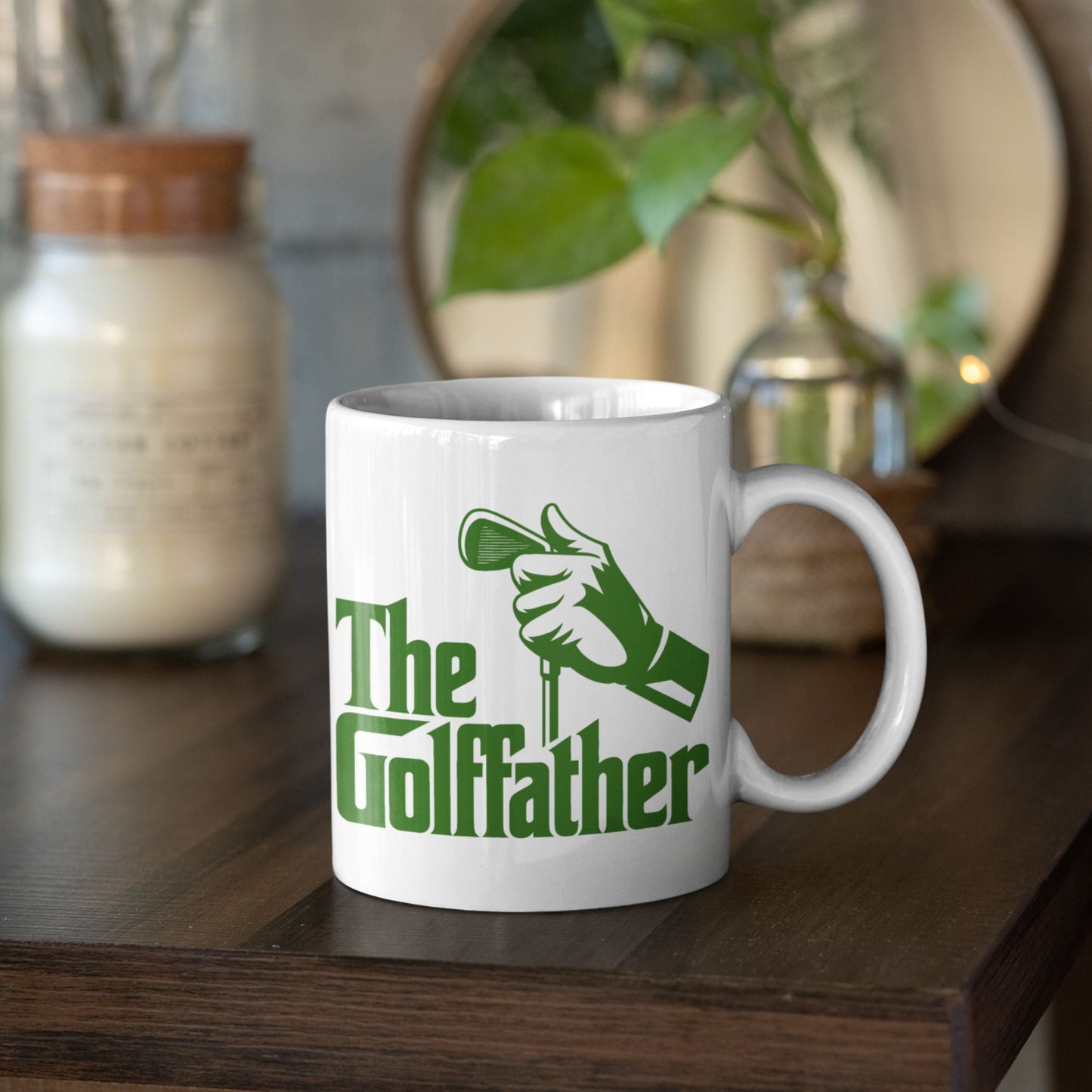 Golffather Funny Coffee Mug on a shelf with candle and decor, an amusing option for golf gifts for dad.