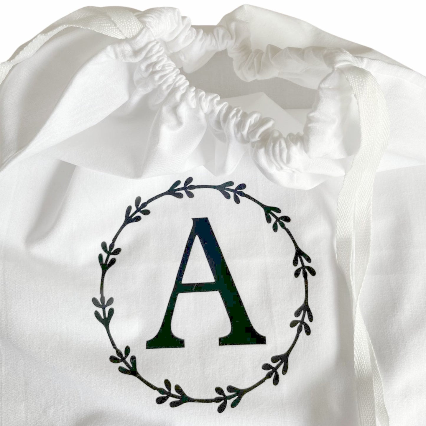 Eco-friendly monogrammed laundry bag - ideal dorm room essential with ample space for laundry.
