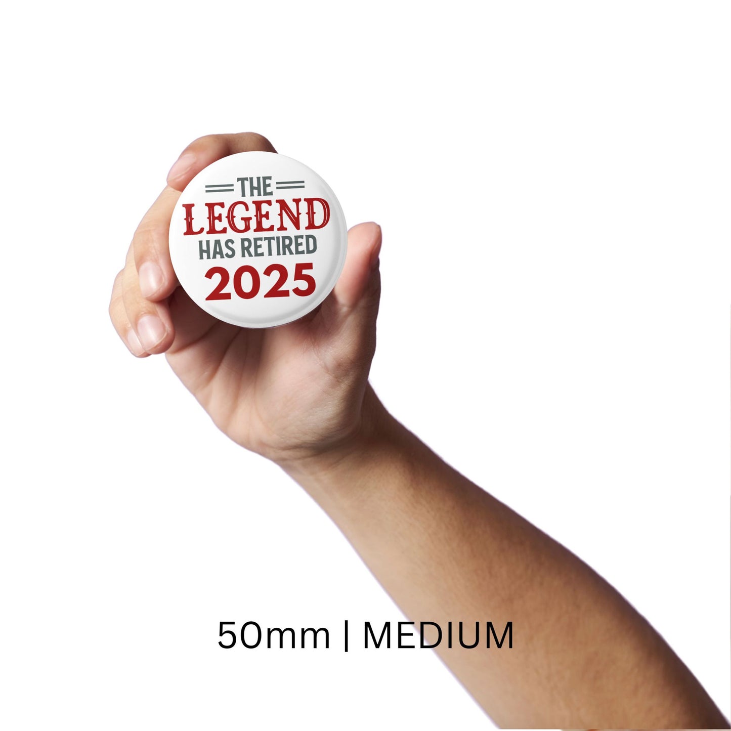 A hand displaying the medium 50mm Retirement Badges 2025 pin, emphasising the vibrant design and text.