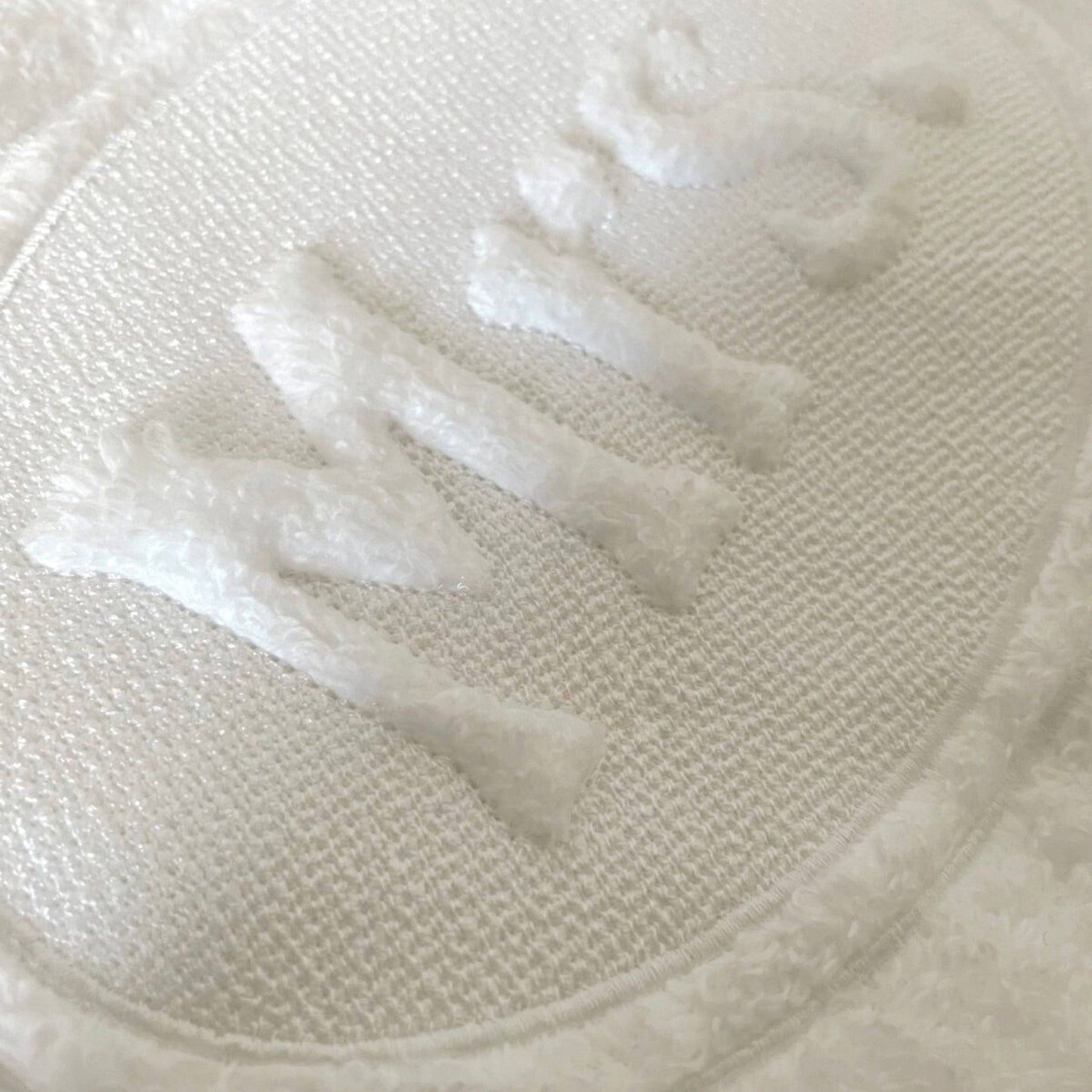 Close-up of a textured white fabric surface