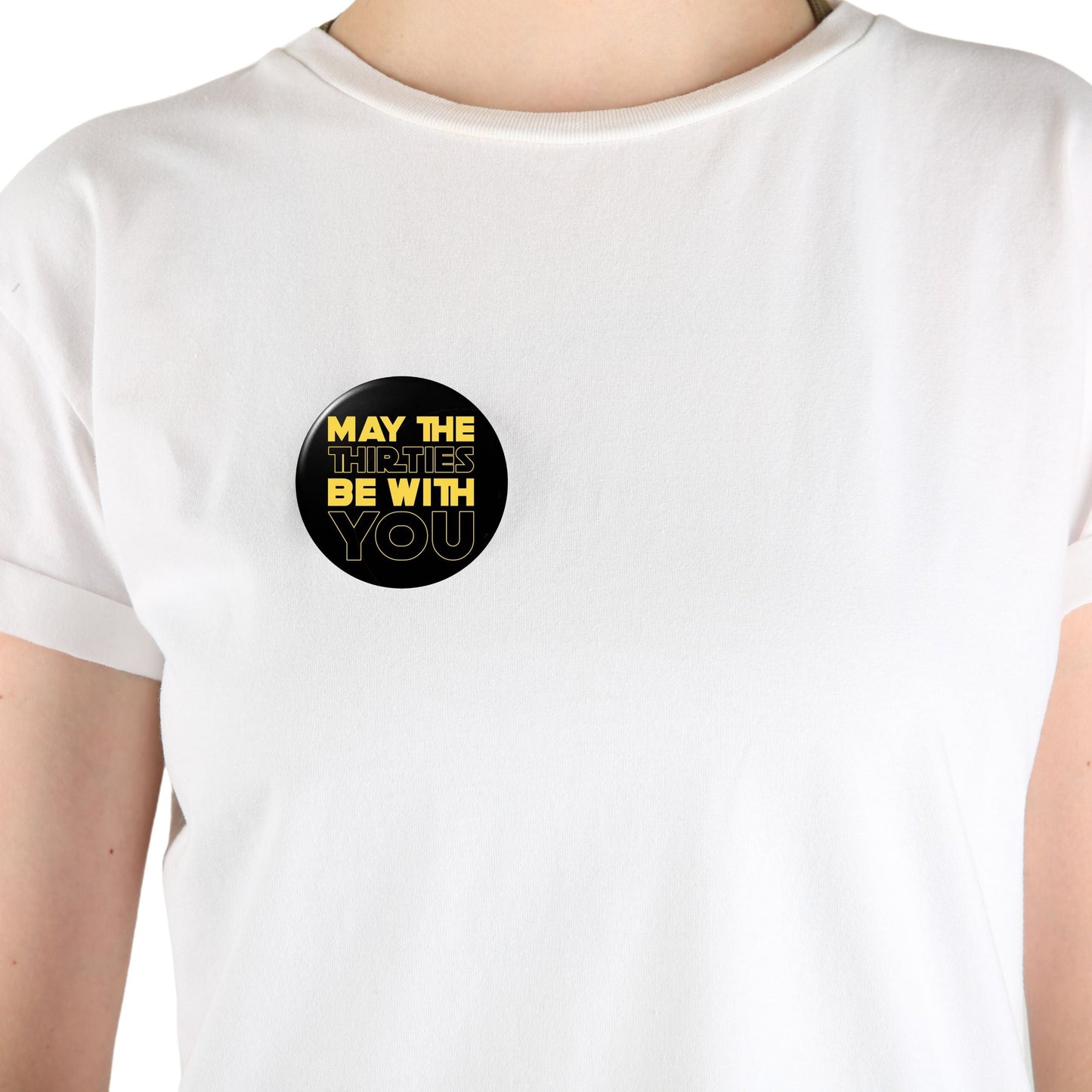 Person wearing a 'May The Thirties Be With You' 30th birthday badge, perfect for party accessories and decorations.