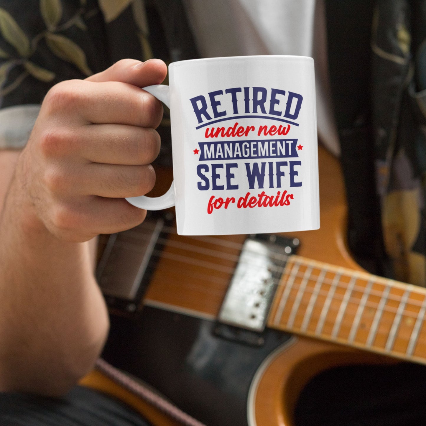 A person enjoying the Happy Retirement Coffee Mug 2025 while sitting with a guitar, a creative gift for retiring colleagues.