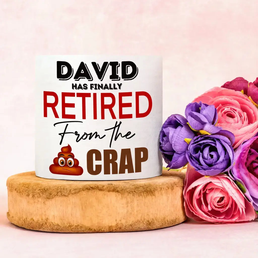 Personalised Retirement Gift: Funny printed toilet roll featuring the phrase 'David has finally Retired From the Crap' alongside vibrant flowers, perfect for adding humour to retirement celebrations.