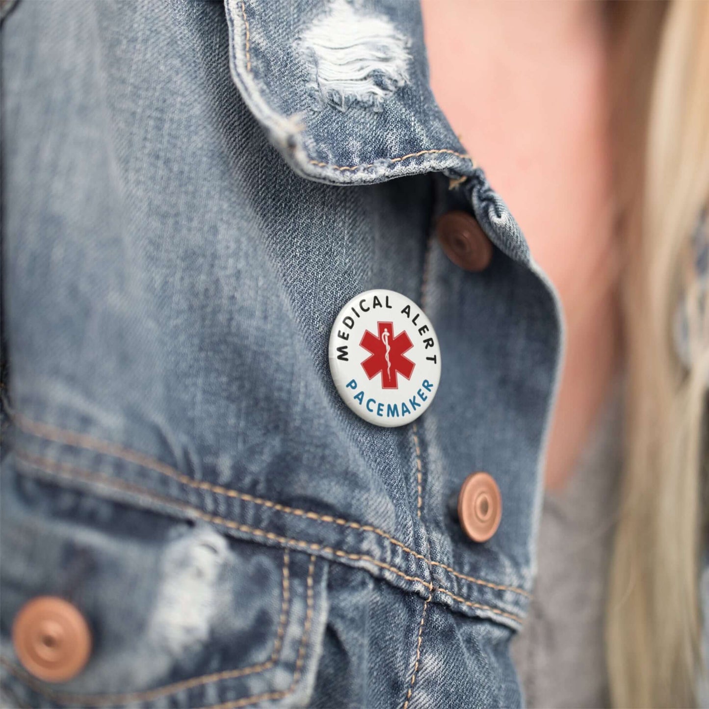Stylish Pacemaker Alert Pin displayed on a denim jacket, promoting health awareness and safety.