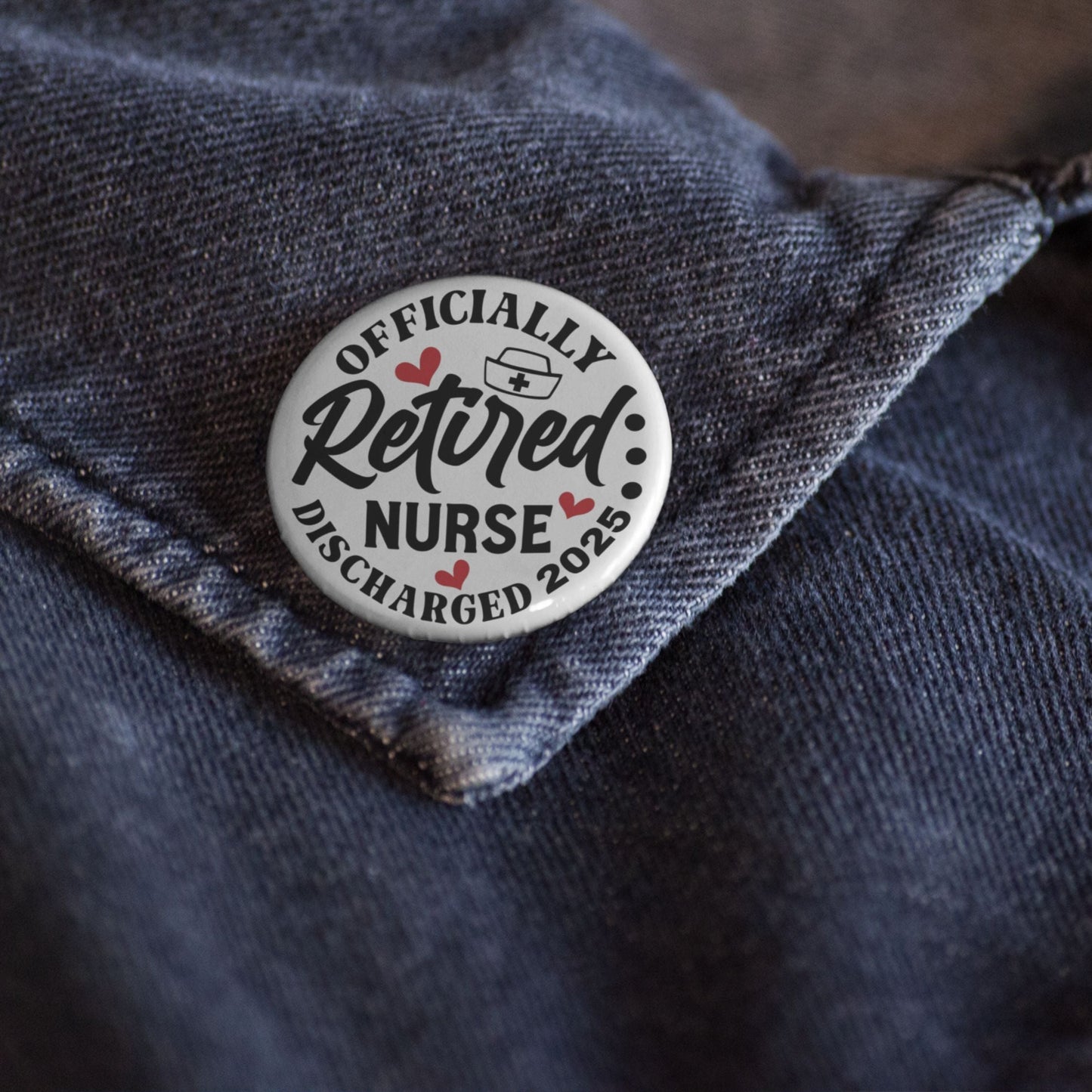Retired Nurse Badge - Officially Retired 1 Inch Health Awareness Pin Button Badge pinned on a shirt, a perfect accessory for retired nurses.