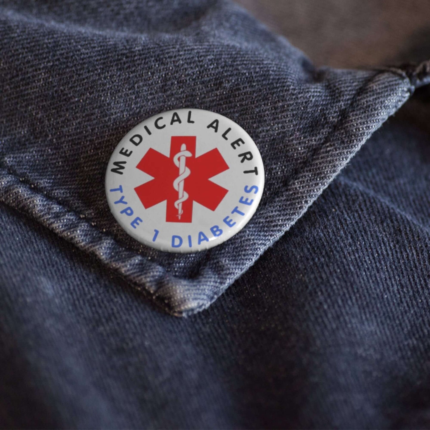 Type 1 Diabetes Safety Item - 25mm Medical Alert Badge pinned to a denim jacket, designed for clear visibility in emergencies.