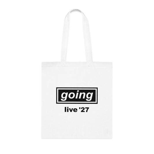 A white canvas tote bag with two shoulder straps, featuring a black graphic print on the front that reads 'going live '27' inside a black rectangular border, shown against a plain white background.