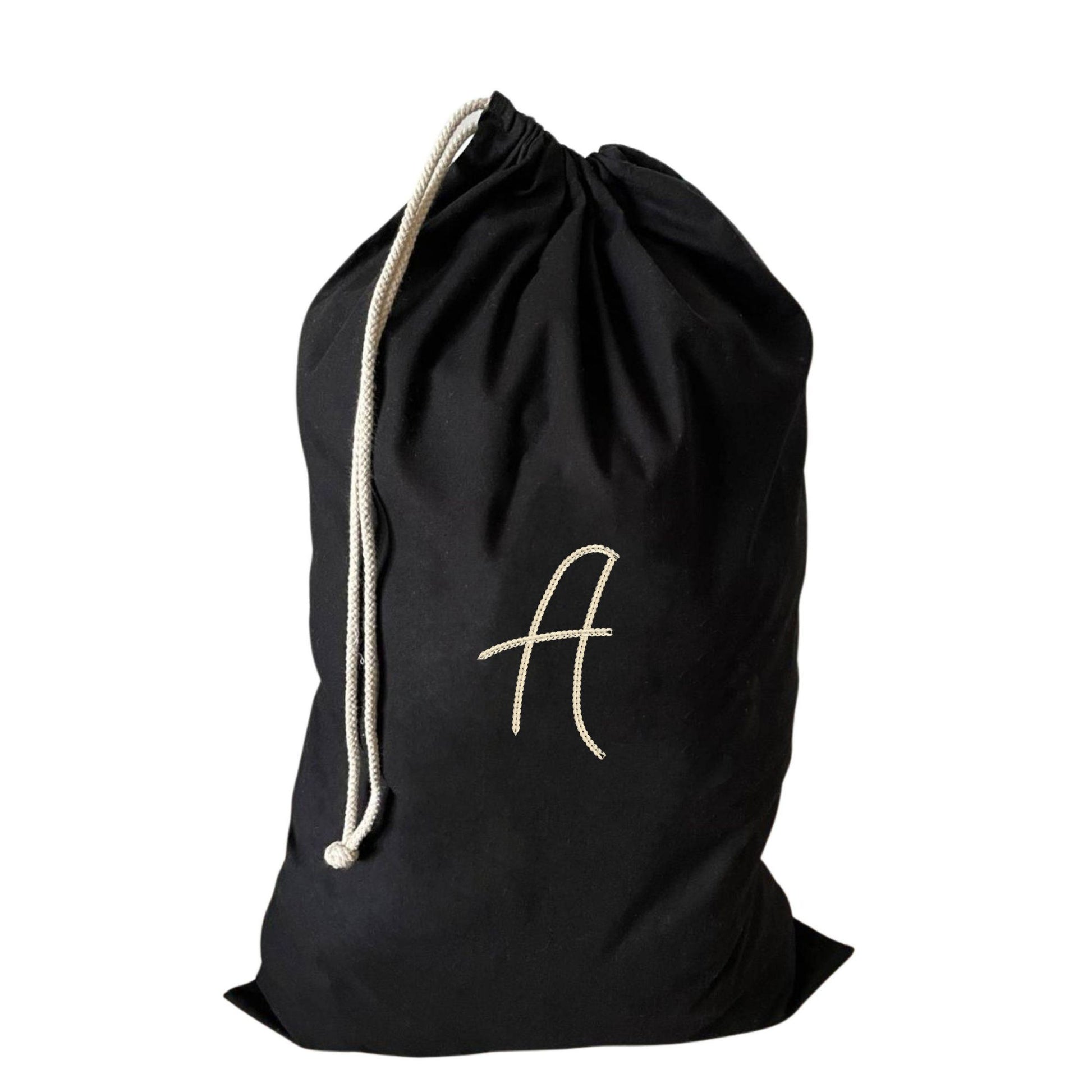 Personalised large drawstring laundry bag with an embroidered A, made from eco-friendly recycled cotton.