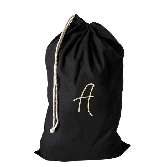 Personalised large drawstring laundry bag with an embroidered A, made from eco-friendly recycled cotton.