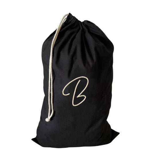 Custom large drawstring laundry bag featuring an embroidered B, perfect for laundry and gym clothes.