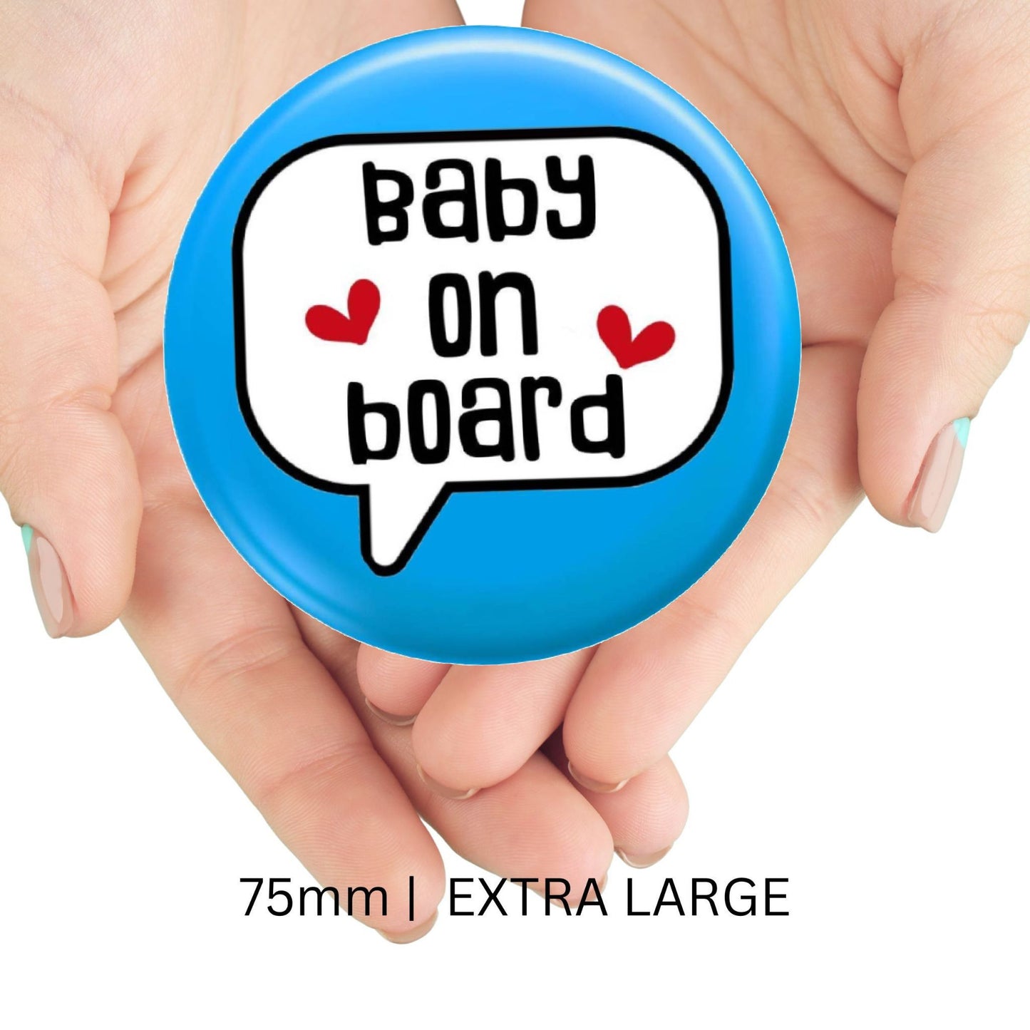Person holding an extra-large blue baby on board badge, size 75mm, showcasing its design for promoting pregnancy awareness.