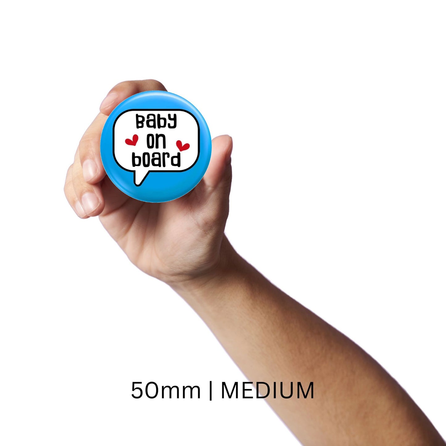 Individual holding a medium-sized blue baby on board badge, size 50mm, perfect for pregnancy awareness and visibility.