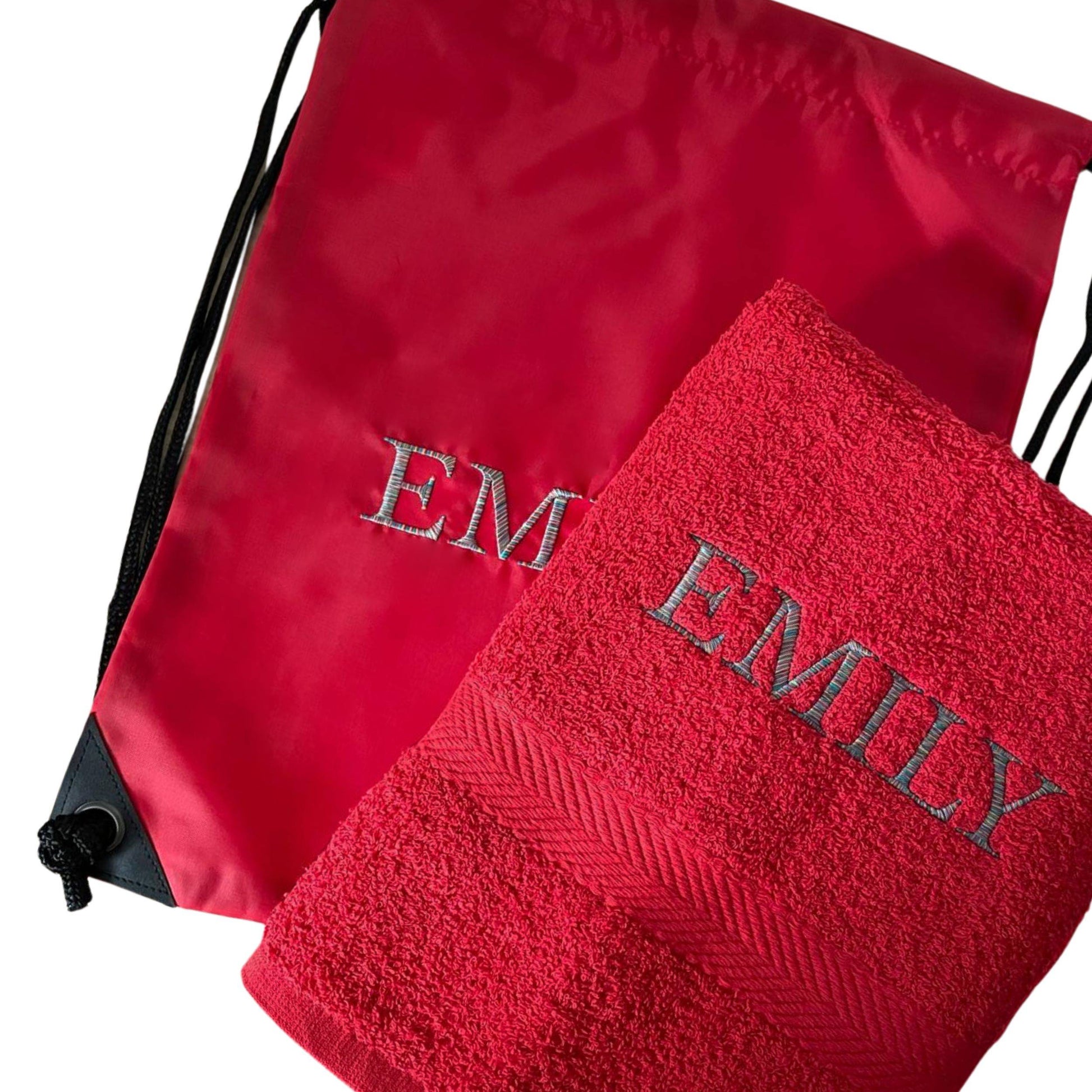 Red drawstring bag and towel with 'EMILY' embroidery on a white background