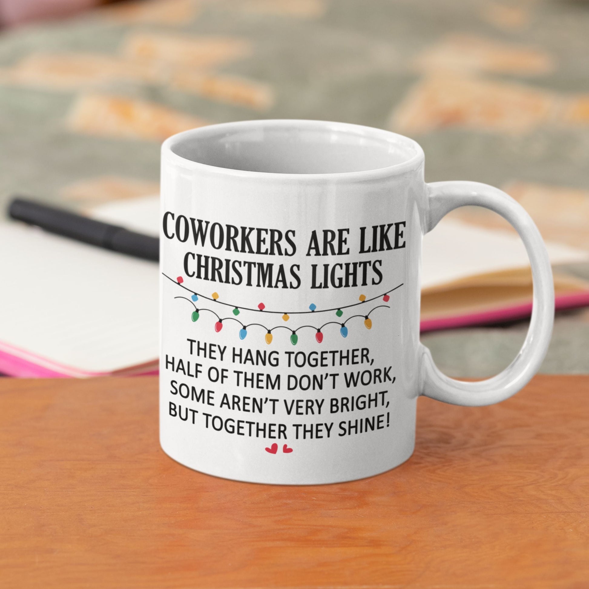 Funny Office Coffee Mug 11oz placed on a casual sofa, highlighting the cheeky message 'Coworkers are like Christmas lights' for a light-hearted touch.