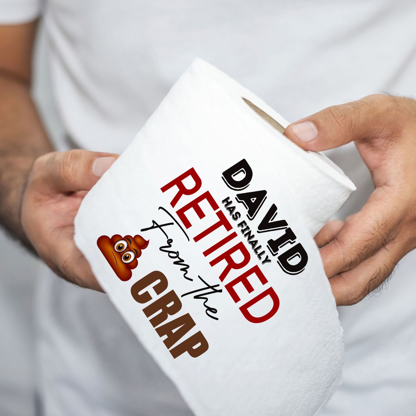 Person holding a toilet roll with the retirement phrase 'David has finally retired from the crap', showcasing its appeal as a funny retirement gift.