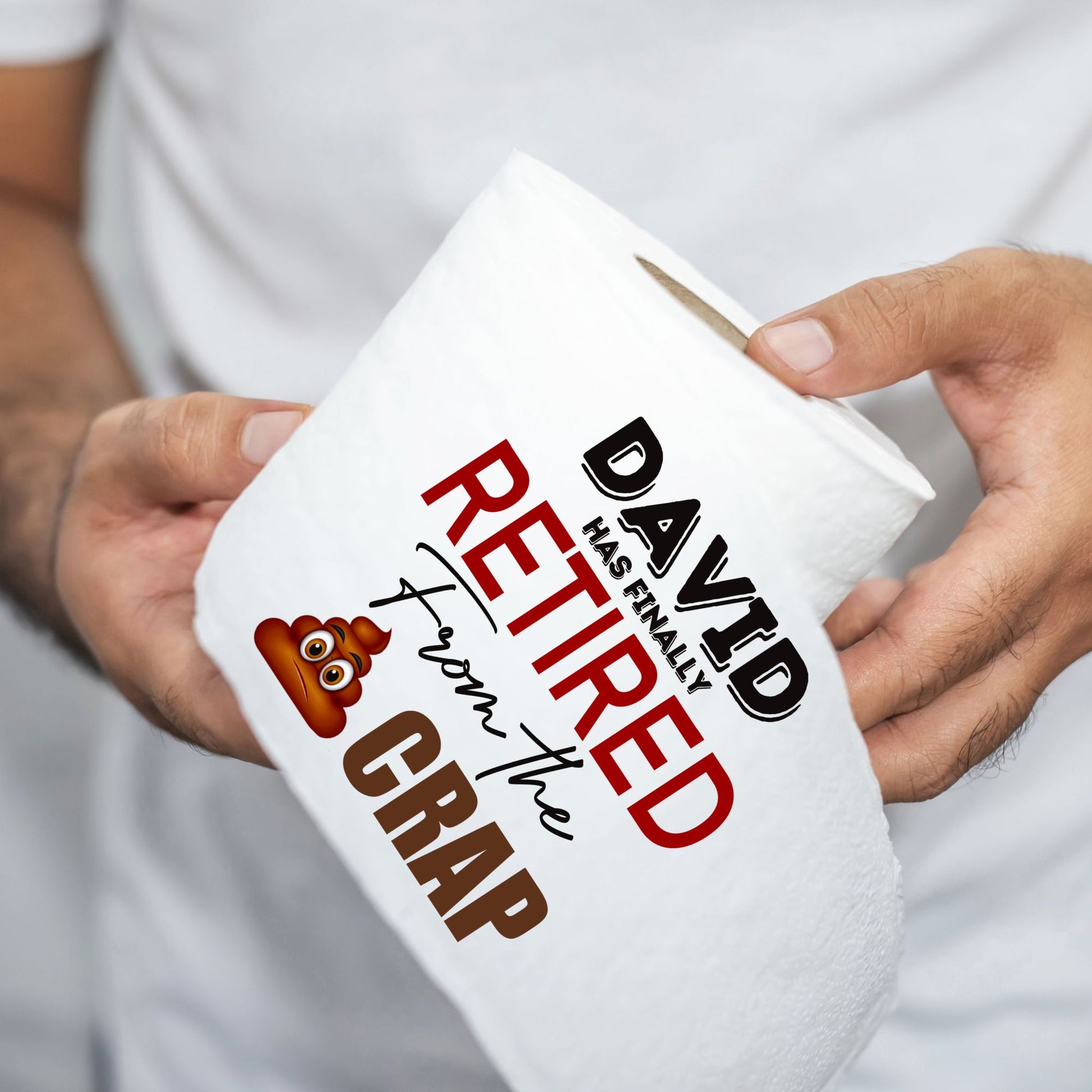 Person holding a toilet roll with the retirement phrase 'David has finally retired from the crap', showcasing its appeal as a funny retirement gift.