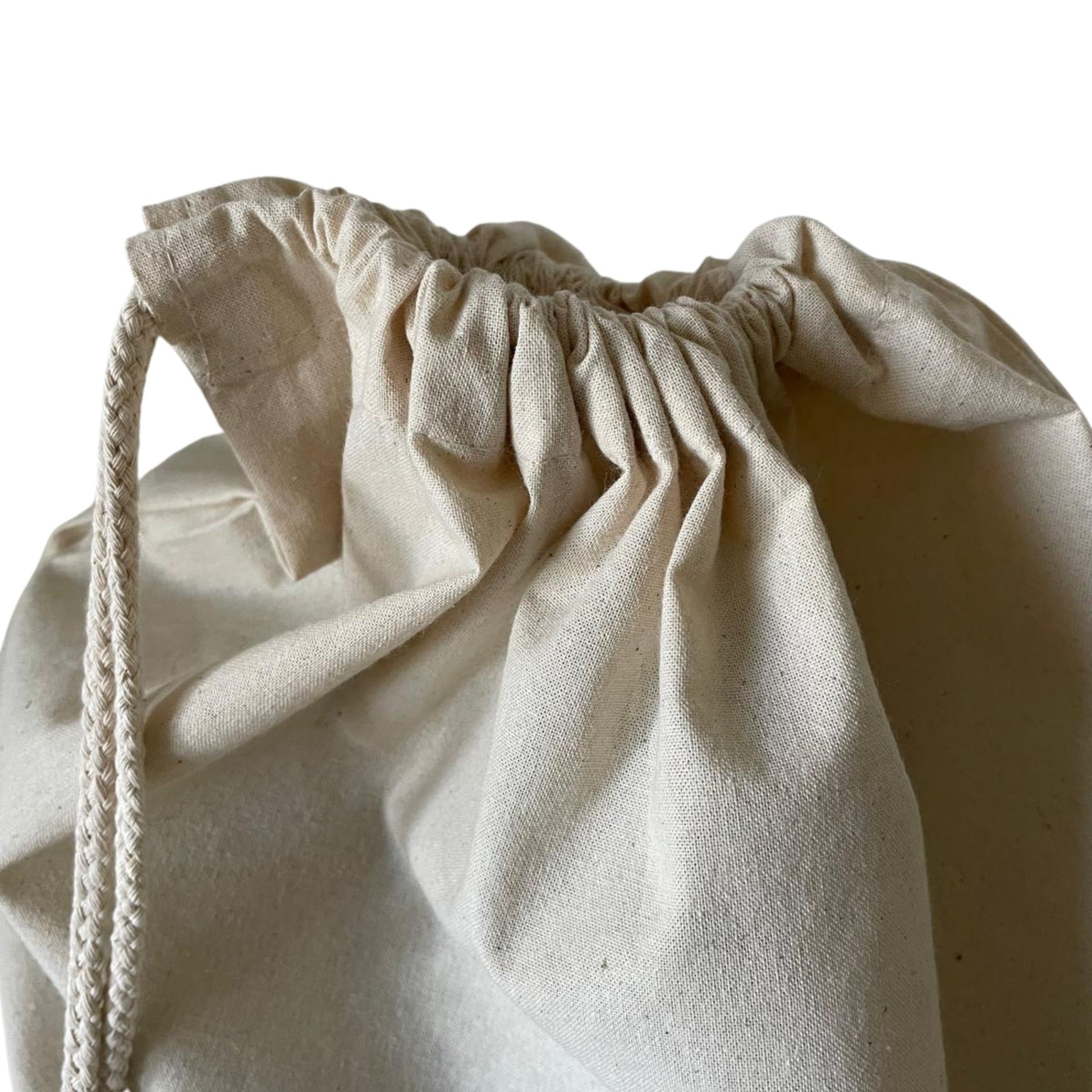 Beige drawstring bag on a white background