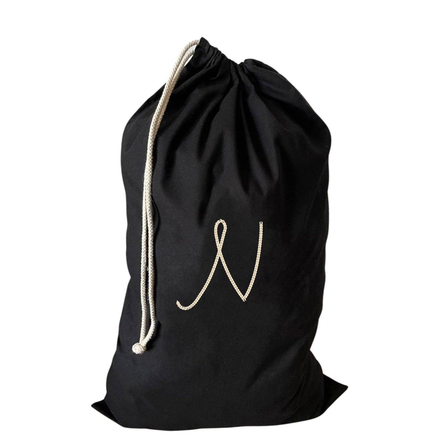 Large drawstring laundry bag showcasing a personalised N, perfect for gym and travel use.