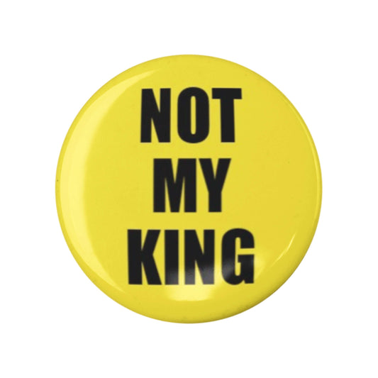 Yellow 'Not My King' anti-monarchy political pin badge with bold black text, symbolizing activism and dissent.