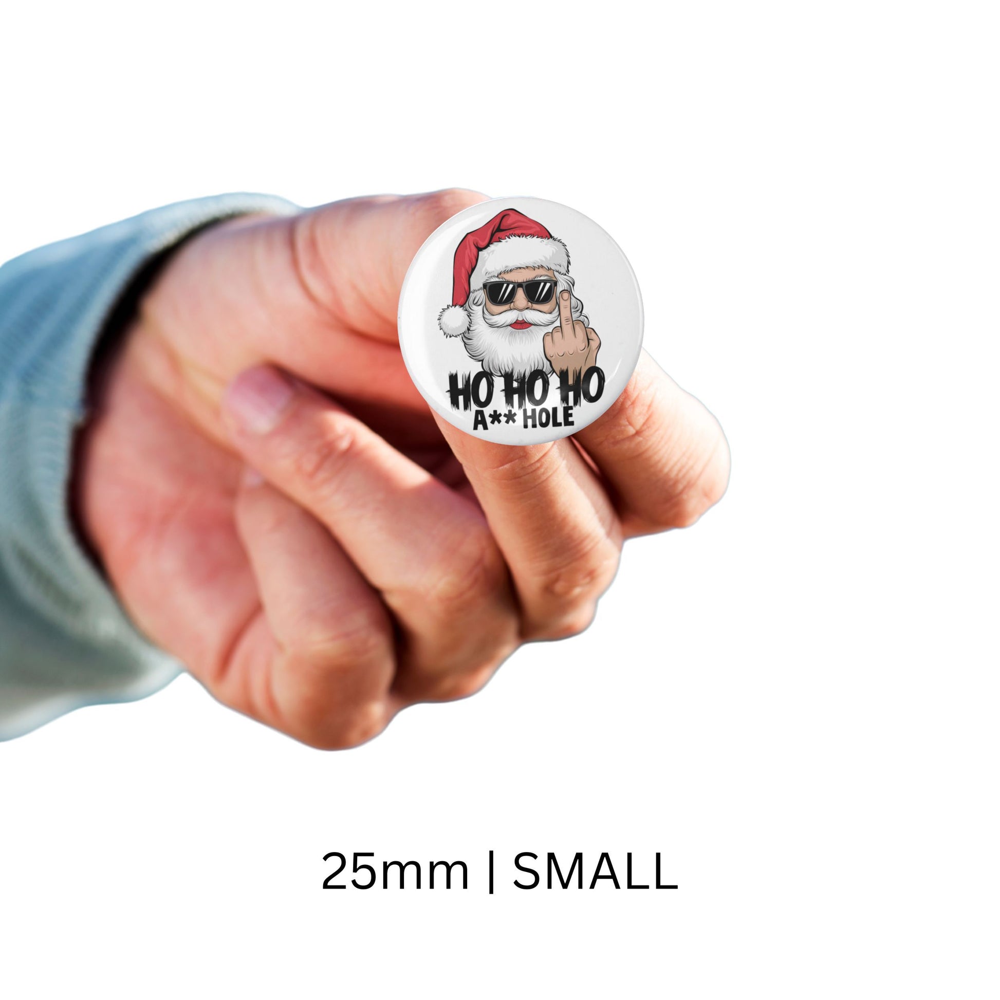 Close-up of a glossy pinback badge with a humorous Santa graphic, ideal as a cheeky Santa gift for holiday gatherings.