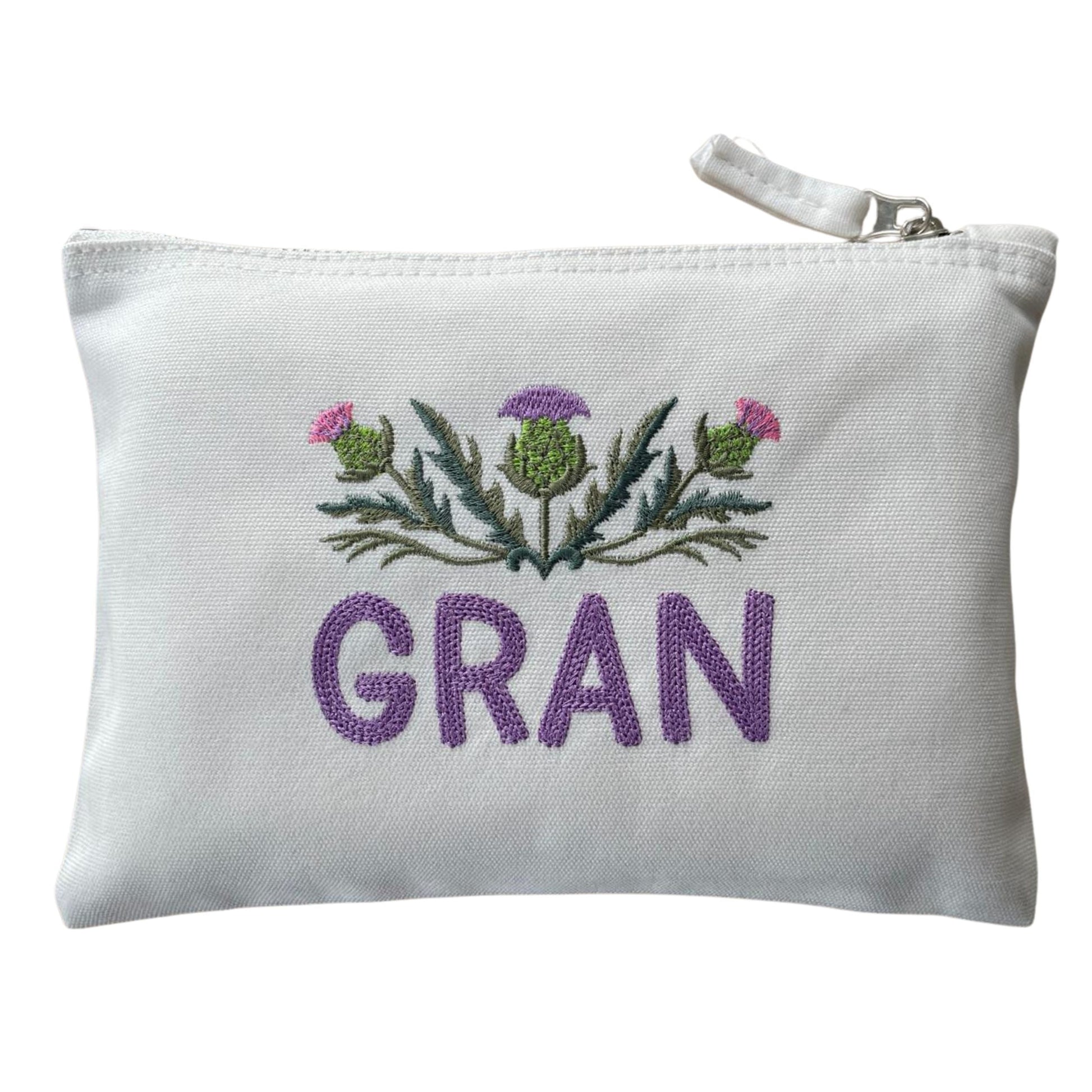 White Custom Scottish Thistle Gift Zipper Pouch with 'GRAN' embroidery. A special Scottish thistle gift for grandmothers.