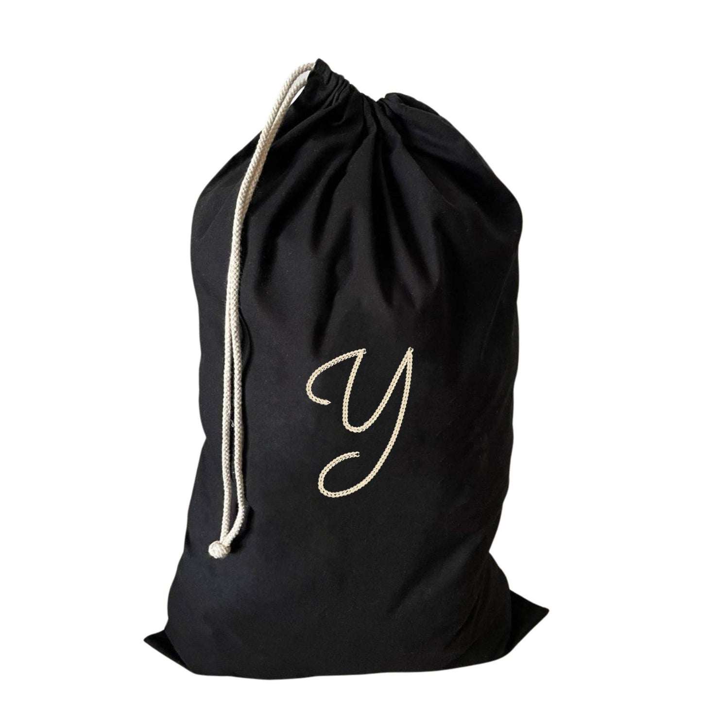 Stylish large drawstring laundry bag with a Y monogram, perfect for students or families.