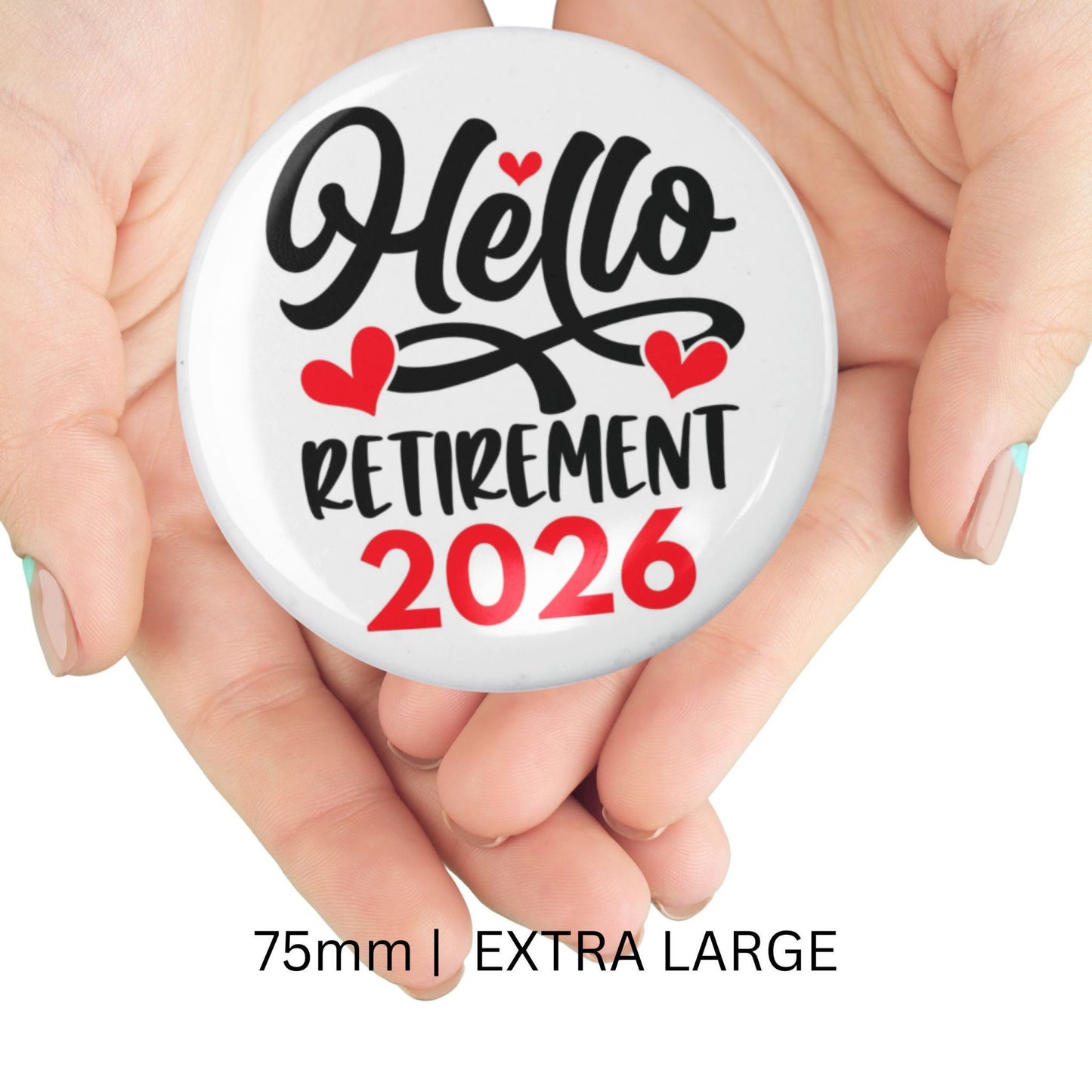 Hands holding the large 75mm Hello Retirement 2026 Badge – Funny Retirement Gift Pin Button.