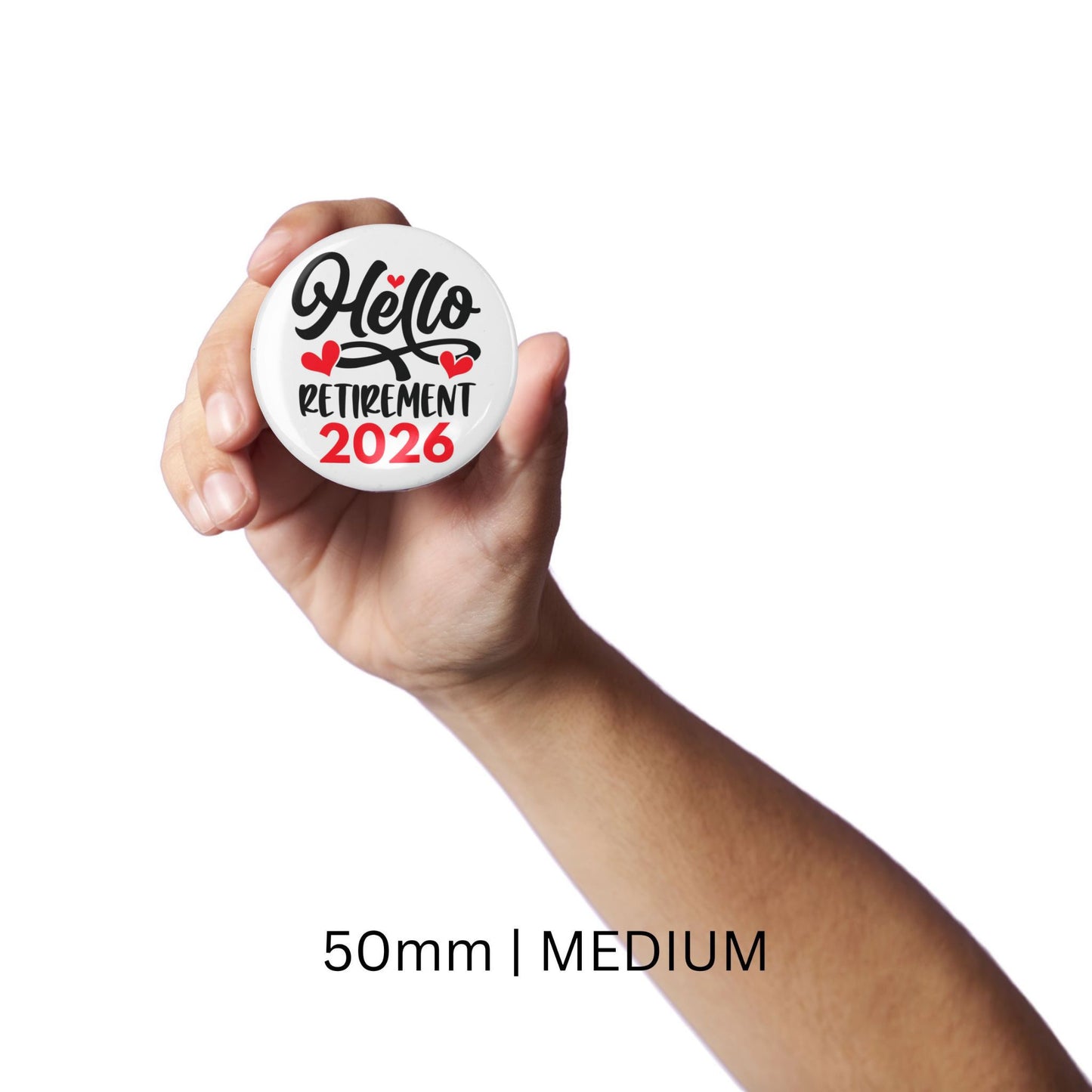 Hand holding the 50mm Hello Retirement 2026 Badge – Funny Retirement Gift Pin Button, showcasing its medium size.