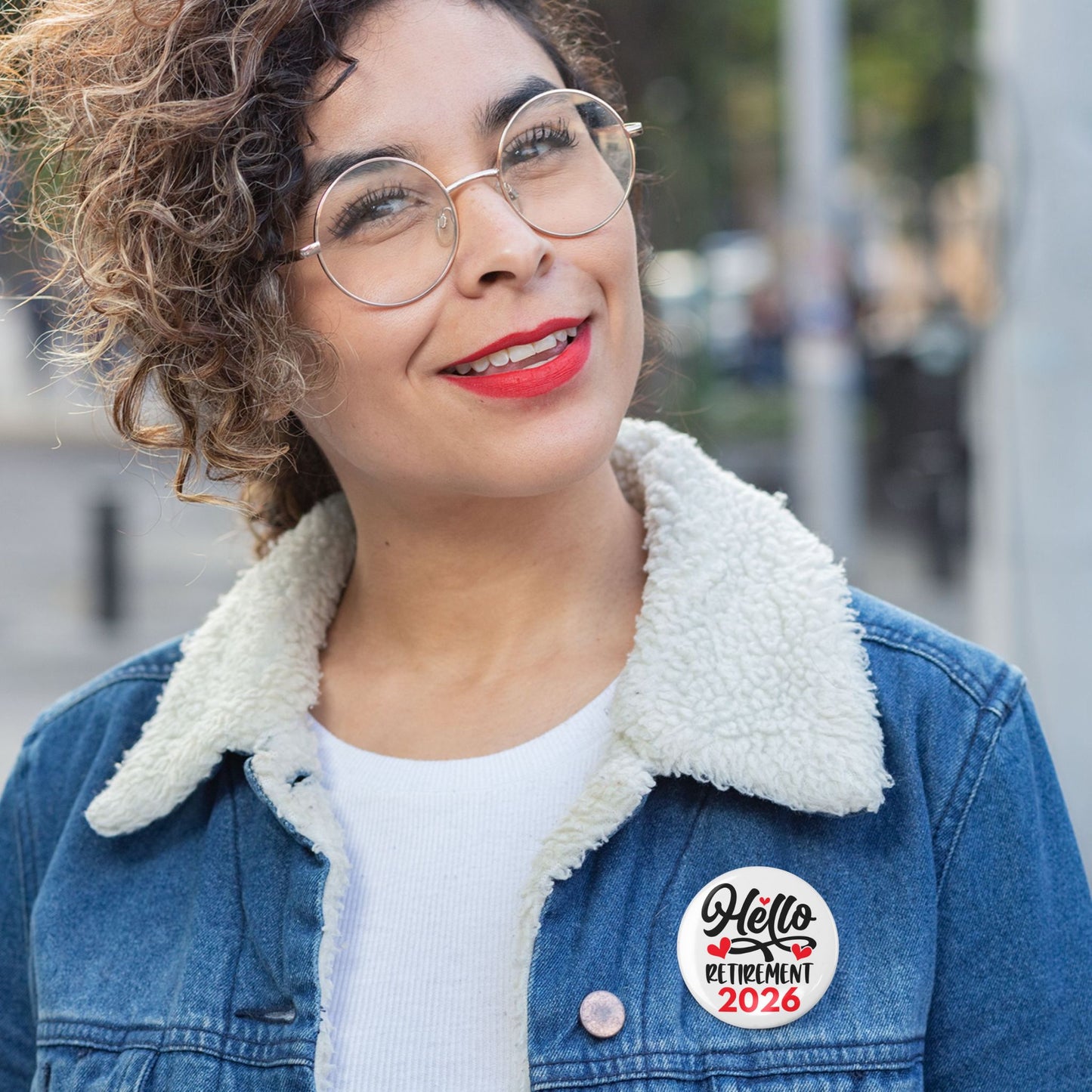 Hello Retirement 2026 Badge – Funny Retirement Gift Pin Button worn on a denim jacket while smiling outdoors.