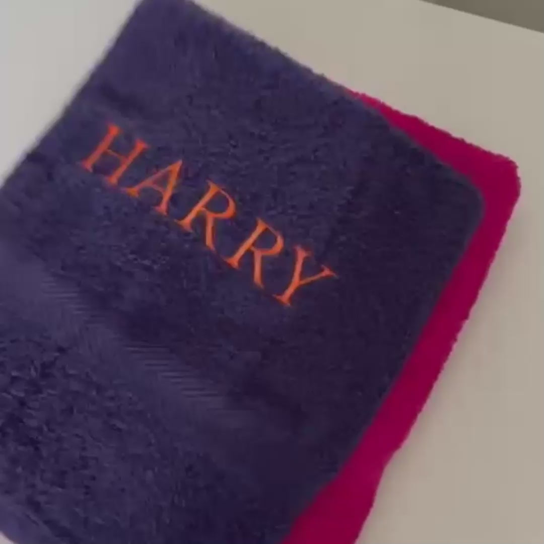 Selection of multicoloured towels and drawstring bags