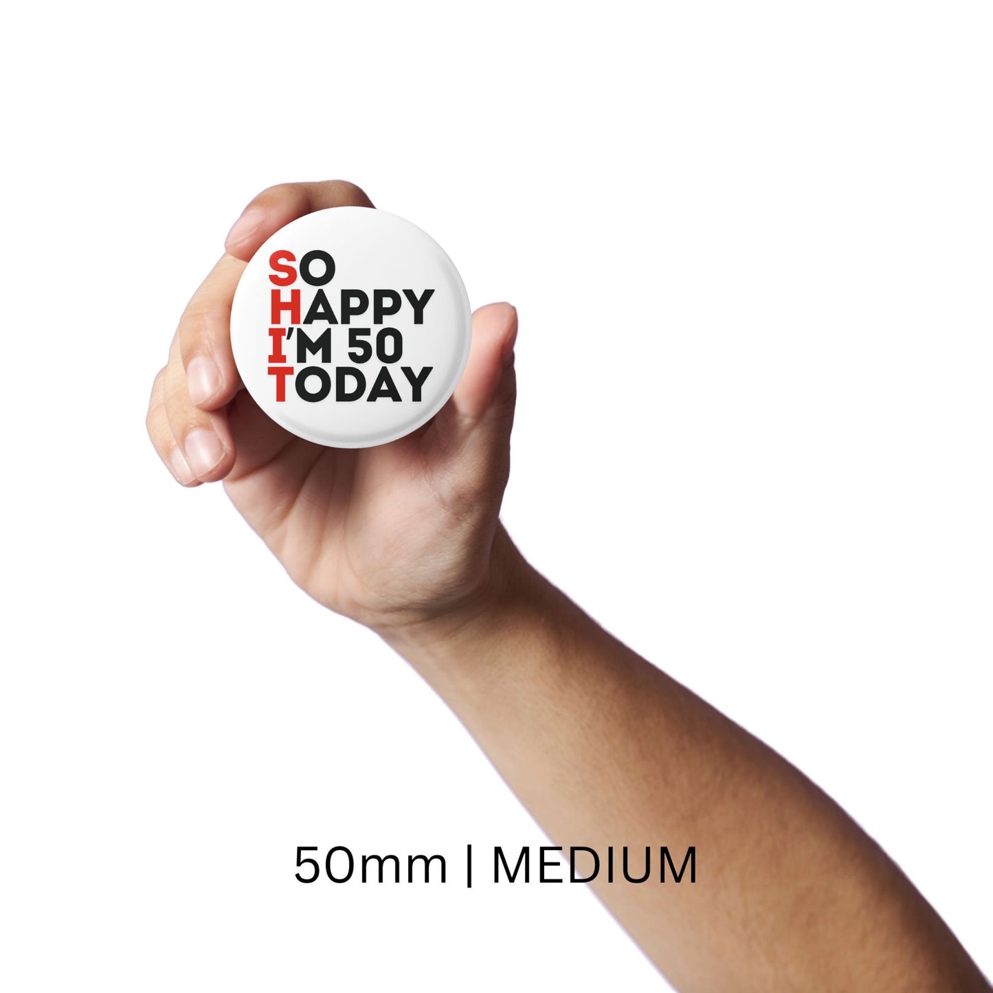 A hand displaying a medium-sized 50th birthday badge with the text 'SO HAPPY I'M 50 TODAY'.